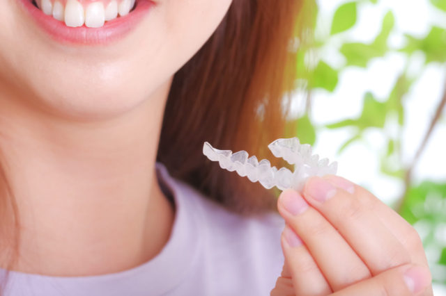 woman with dental mouthpiece